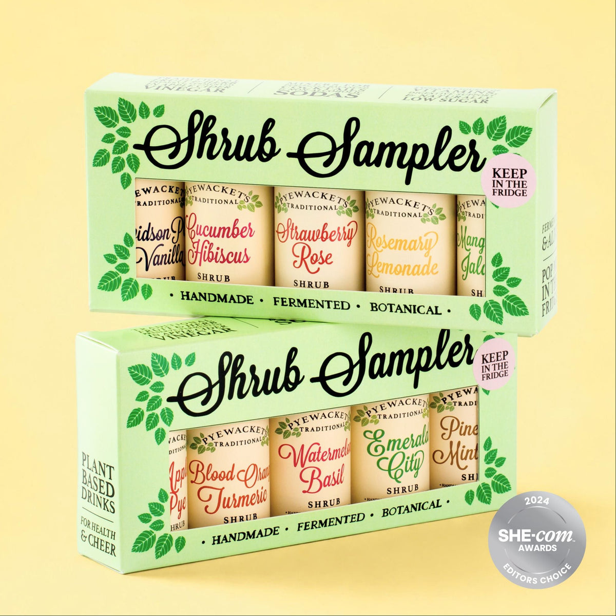 Two Shrub Sampler gift boxes shown on a pale yellow background. The boxes contain multiple small bottled shrubs with labels such as Cucumber Hibiscus, Strawberry Rose, Watermelon Basil, and Pineapple Mint.