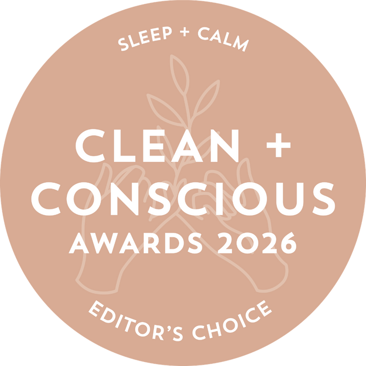 A circular beige award badge reading 'SLEEP + CALM', 'CLEAN + CONSCIOUS AWARDS 2026', and 'EDITOR'S CHOICE' in white text, with a faint botanical and hands illustration in the background.