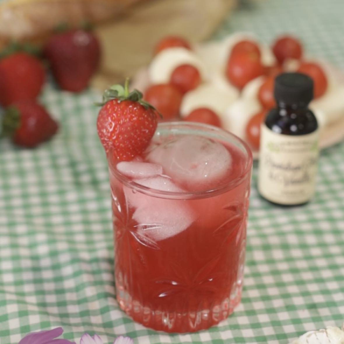Davidson plum and vanilla shrub soda with strawberry garnish