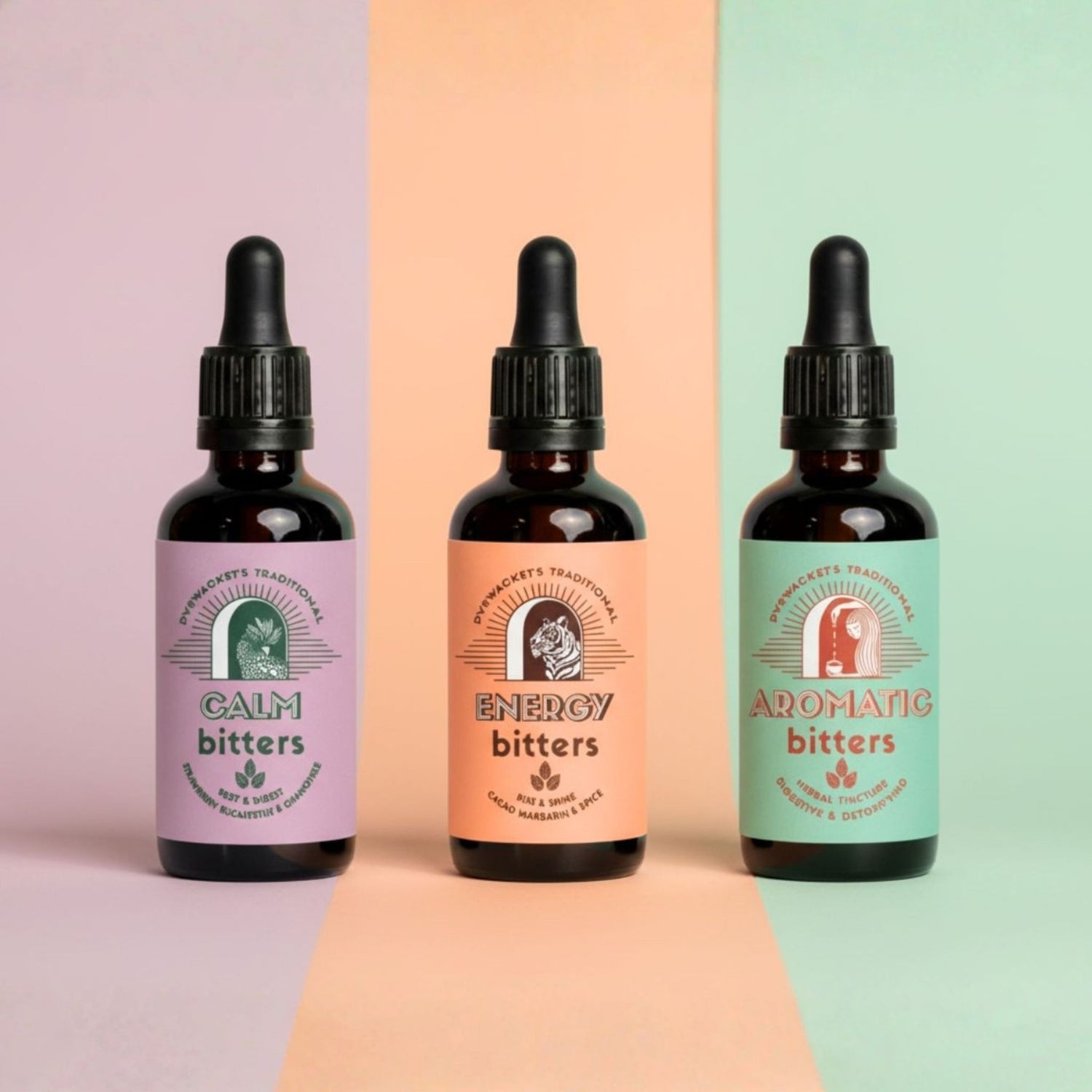 Three bottles of digestive bitters with different flavors on a colorful background