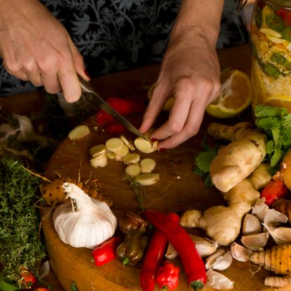 Chopping ginger to make fire cider tonic 