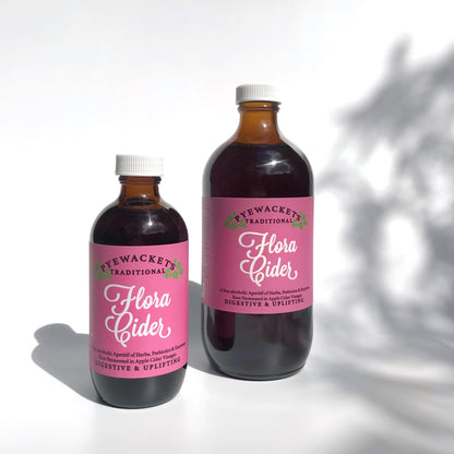 small and large bottles of flora cider aperitif tonic from pyewackets traditional