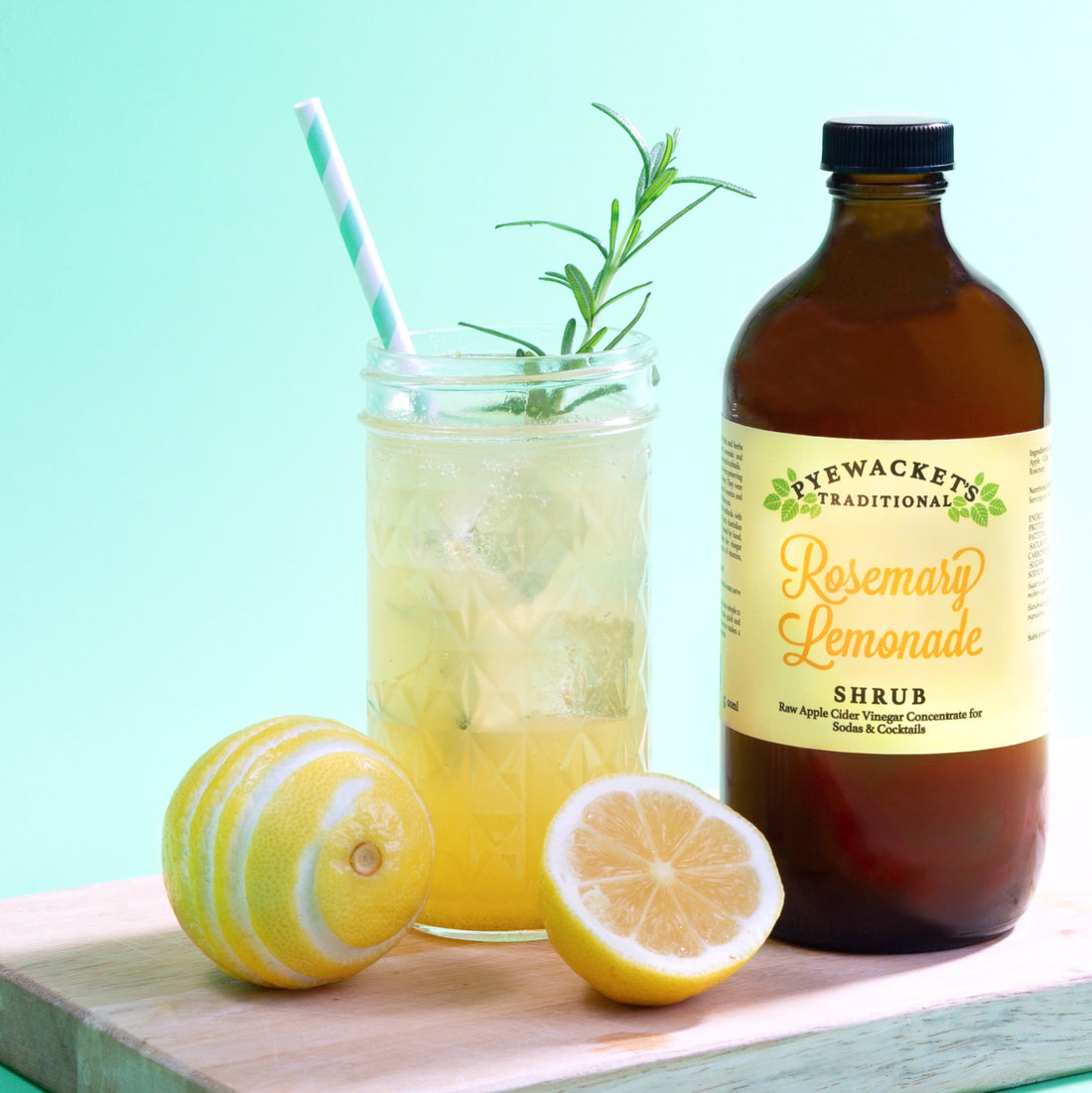 large rosemary lemonade shrub bottle and drink